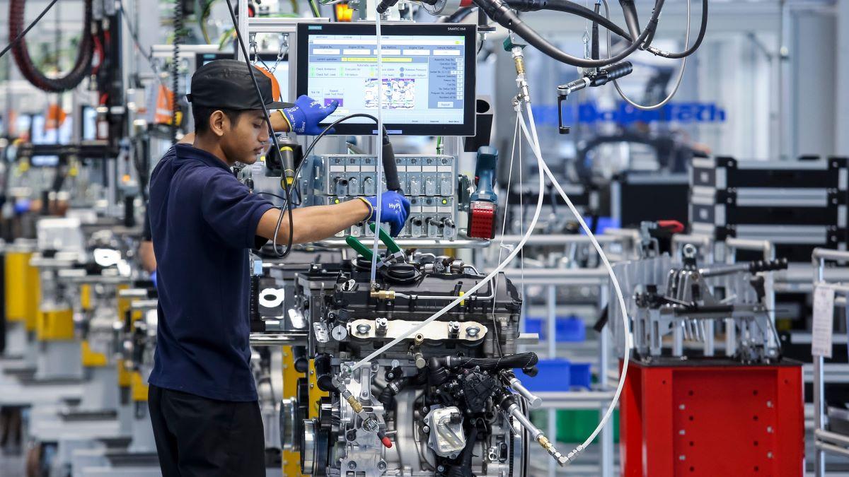 Workers at engine assembly plant in Malaysia, catering for both the domestic and export markets.